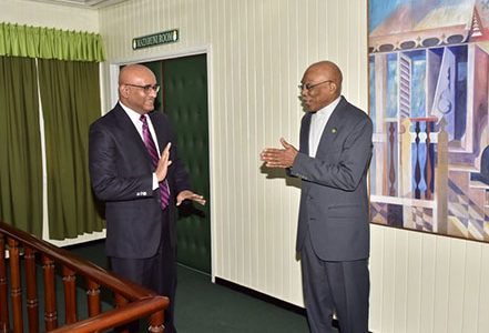 President David Granger (right) greeting Opposition Leader Bharrat Jagdeo at the Ministry of the Presidency yesterday. (Ministry of the Presidency photo)