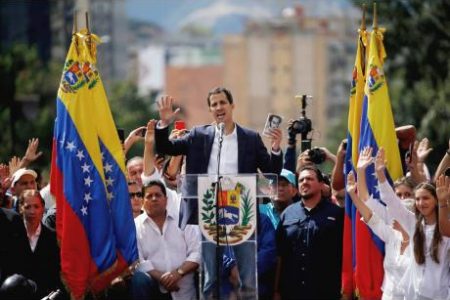 Juan Guaido, head of Venezuela''s opposition-run congress, declares himself interim president of Venezuela during a rally demanding President Nicolas Maduro''s resignation in Caracas, Venezuela, on Wednesday.