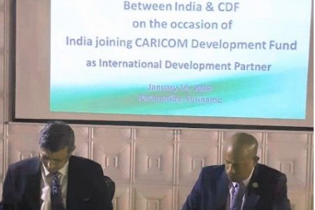 In photo, Mahender Singh Kanyal (left), High Commissioner of India to Barbados (Designate) signing the Contribution Agreement with Chief Executive Officer of the CDF,  Rodinald Soomer