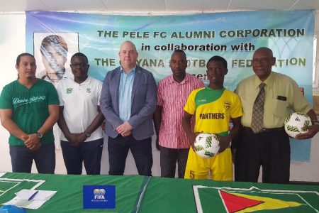 GFF Technical Director Ian Greenwood [centre] is flanked by members of the launch party for the Frank Watson Memorial National U-15 Intra-Association Football Playoff. Also in the photo are Pele Alumni member and former President John Yates [right] and GFF Youth Development Officer [2nd from left], Santos FC executive Frank Parris [3rd from right] and Timehri Panthers President Adrian Gonsalves [left]
