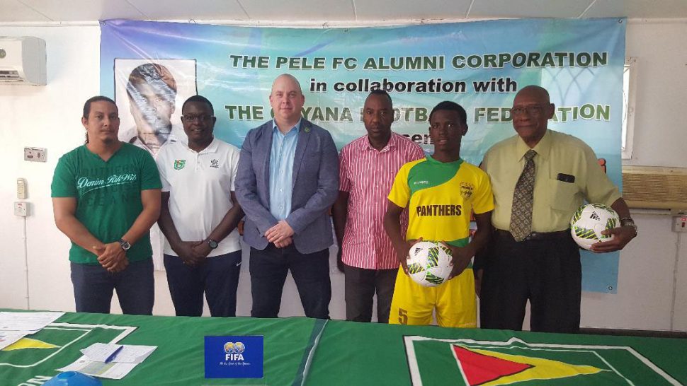 GFF Technical Director Ian Greenwood [centre] is flanked by members of the launch party for the Frank Watson Memorial National U-15 Intra-Association Football Playoff. Also in the photo are Pele Alumni member and former President John Yates [right] and GFF Youth Development Officer [2nd from left], Santos FC executive Frank Parris [3rd from right] and Timehri Panthers President Adrian Gonsalves [left]
