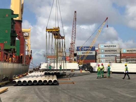 The pipes being unloaded (ExxonMobil photo)