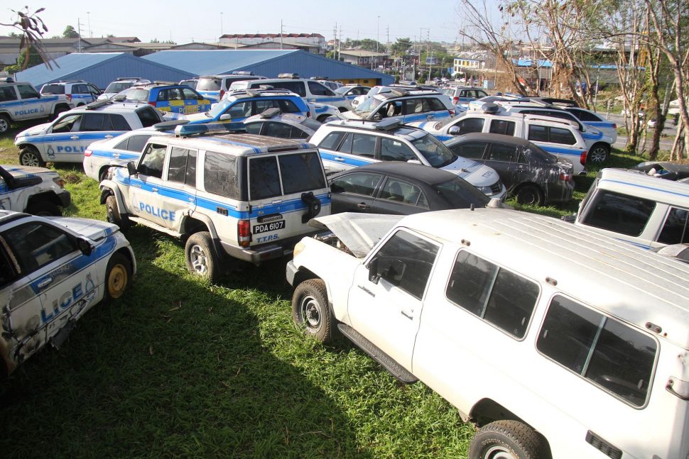 Scores of derelict police vehicles at the Vehicle Management Corporation in San Fernando.