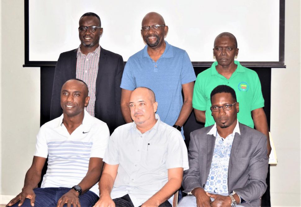 The newly elected GABF President Michael Singh [sitting centre] posing with members of his new executive committee after being elected unopposed to the helm of local basketball. Sitting from left to right are Kenrick Thomas and Lawrence Simon, while standing left to right are Junior Hercules, Alex Graham and Joseph Chapman.
