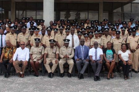 This police photo shows Police Service Commission Chairman Paul Slowe (seated fourth from right) with Police Commissioner Leslie James (seated fifth from right), the newly promoted personnel and other police officials.
