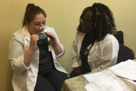 One of Professor Sharon Armstrong’s students demonstrating how spirometry testing is performed to diagnose a patient who is affected by respiratory illness. (DPI photo)
