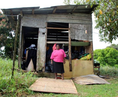 WHAT NEXT?: Zeia Flemming stands in front of her Pleasantville home which, she claimed, was partially destroyed by the landowner who has been trying for some time to get her to leave. PHOTO BY VASHTI SINGH