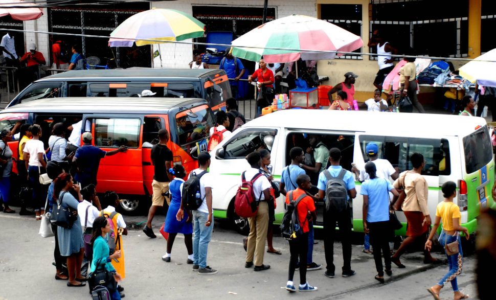 In high demand: Privately-owned minibuses transport more than 200,000 passengers daily in parts of coastal Guyana.
