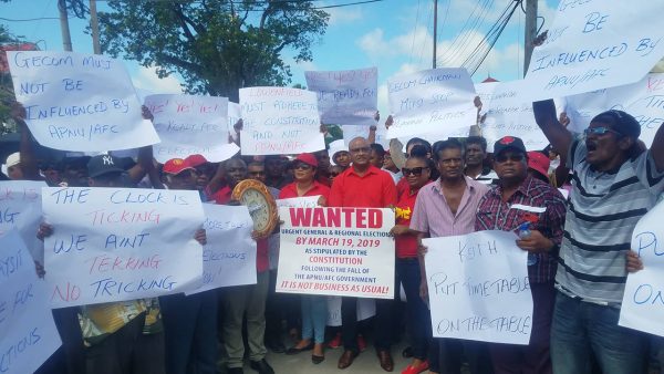 PPP General Secretary Bharrat Jagdeo (standing at centre) surrounded by supporters at yesterday’s protest. (Photo by Terrence Thompson)