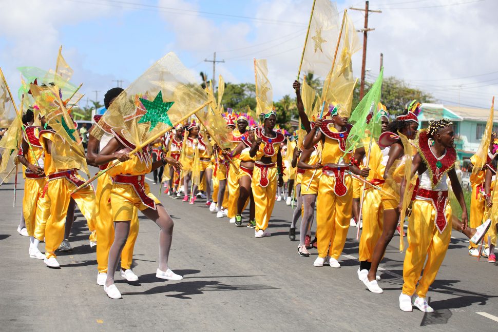 Hyped revelers from the Region 6 band performing at one of the judging points along the parade route.
