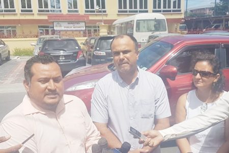 Three of the parents who turned up in front of the Ministry of Public Security on Brickdam yesterday to voice their concerns. From left are John Ramsingh, Jerry Gouveia and Head of the School of Nations Parent-Teacher Association Ann Lisa Fraser-Phang