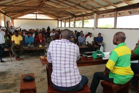 Minister of Foreign Affairs Carl Greenidge (right) and Minister of Public Infrastructure David Patterson (left) field questions during a meeting in Karaudarnau. (DPI photo)
