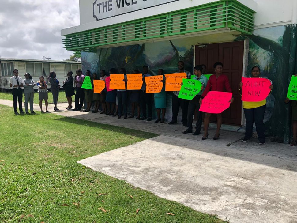 Staff of the University of Guyana gathered outside of the Vice Chancellery yesterday afternoon. 