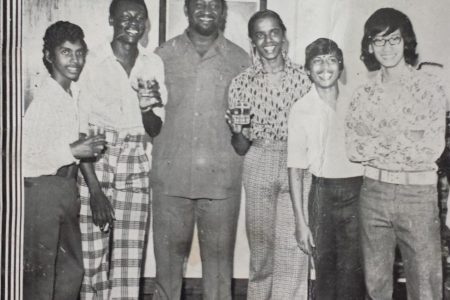 Flashback! This was the cover of the January 1977 chess magazine Ajedrez which was published by the Guyana Chess Federation. President of the federation Burnham is at centre. The occasion was a cocktail reception at the Residence for the first presentation of the Burnham Trophy to the winner of the National Chess Championship. From left are: Nigel Jagan, Wendell Jackman, Aftab Karimullah, Roy Khan and Michael Chan.  