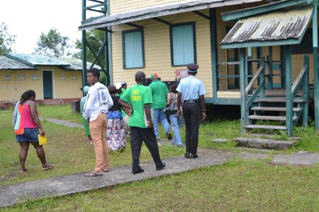 Minister of Finance Winston Jordan and others touring the school (DPI photo)