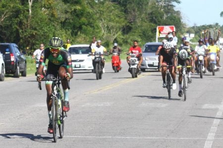 Romello Crawford is all alone as he approaches the finish line in the third and final leg of the annual Forbes Burnham Memorial three stage cycle road race yesterday. (Orlando Charles photo)
