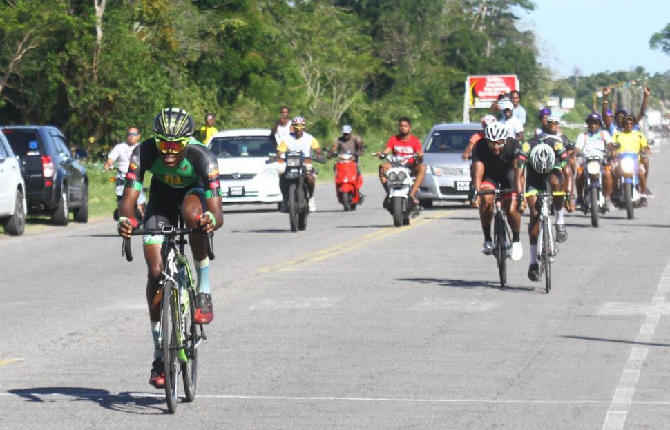 Romello Crawford is all alone as he approaches the finish line in the third and final leg of the annual Forbes Burnham Memorial three stage cycle road race yesterday. (Orlando Charles photo)
