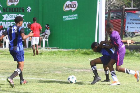 Action between Cummings Lodge and Uitvlugt in the Milo Secondary Schools Football Championships at the Ministry of Education ground, Carifesta Avenue, yesterday.
