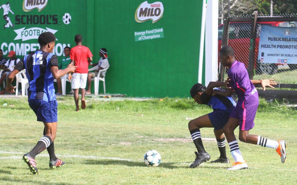 Action between Cummings Lodge and Uitvlugt in the Milo Secondary Schools Football Championships at the Ministry of Education ground, Carifesta Avenue, yesterday.
