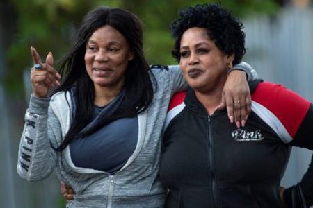 Pam (left), a 55-year-old deportee from the United Kingom, hugs an unnamed friend after leaving the Harman Barracks detention centre on Wednesday, February 6. She was the sole woman among a group of 29 deportees.
