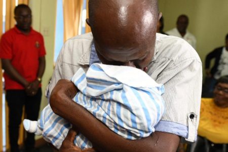 An emotional Sinclair Hutton meets his baby Sae'Breon for the first time after the baby was snatched from the hospital
