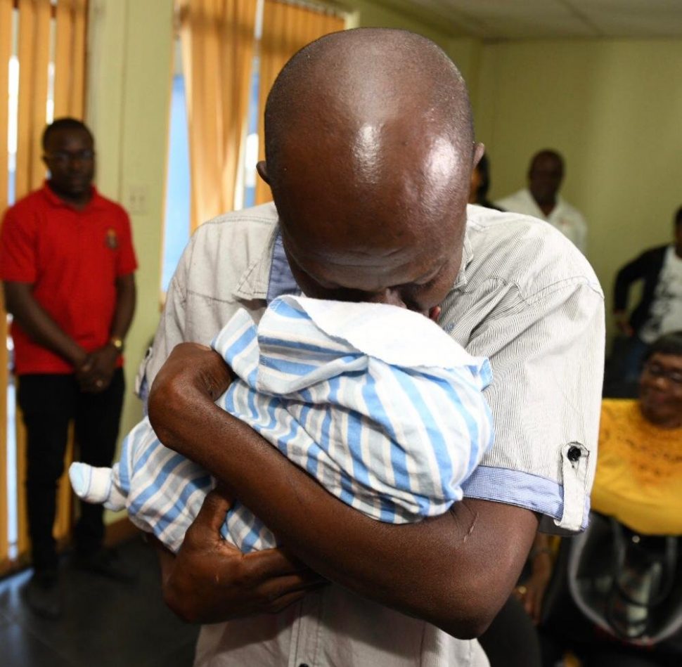 An emotional Sinclair Hutton meets his baby Sae'Breon for the first time after the baby was snatched from the hospital