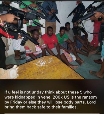 Kidnappers train their guns at five of the six Trinidad & Tobago fishermen who were reportedly abducted and taken to Venezuela. The victims were from left Brandon Arjoon, Jason O'Brian , Jagdesh Jude Jaikaran, Jerry O'Brian , Linton Manohar and missing from photo Ricky Rambharose.