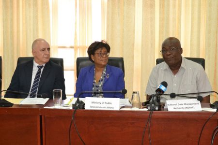 In photo, from left are UNDP Resident Representative (ag),  Roberto Galvez, Minister of Public Telecommunications, Catherine Hughes and NDMA Chairman, Floyd Levi. (Department of Public Information photo)