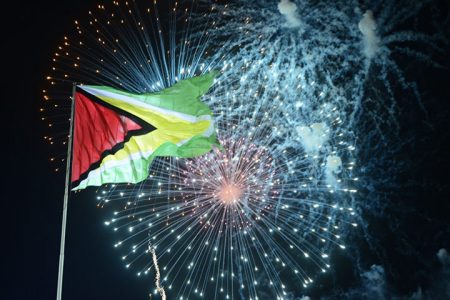 The Golden Arrowhead: The raised flag of Guyana lit up by fireworks at last night’s Republic anniversary celebrations at D’Urban Park.
