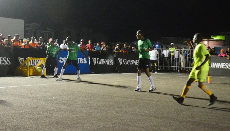  GOAL! Phoenix Ballers [dark green] concedes their first goal against West Side Ballers at the Pouderoyen Tarmac in the  Guinness ‘Greatest of the Streets’ West Demerara, East Bank Demerara Championships.

