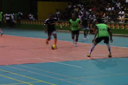 Action between Sparta Boss and Gaza Squad  at the National Gymnasium, Mandela Avenue in the 2nd Annual Magnum Futsal Championship on Tuesday.