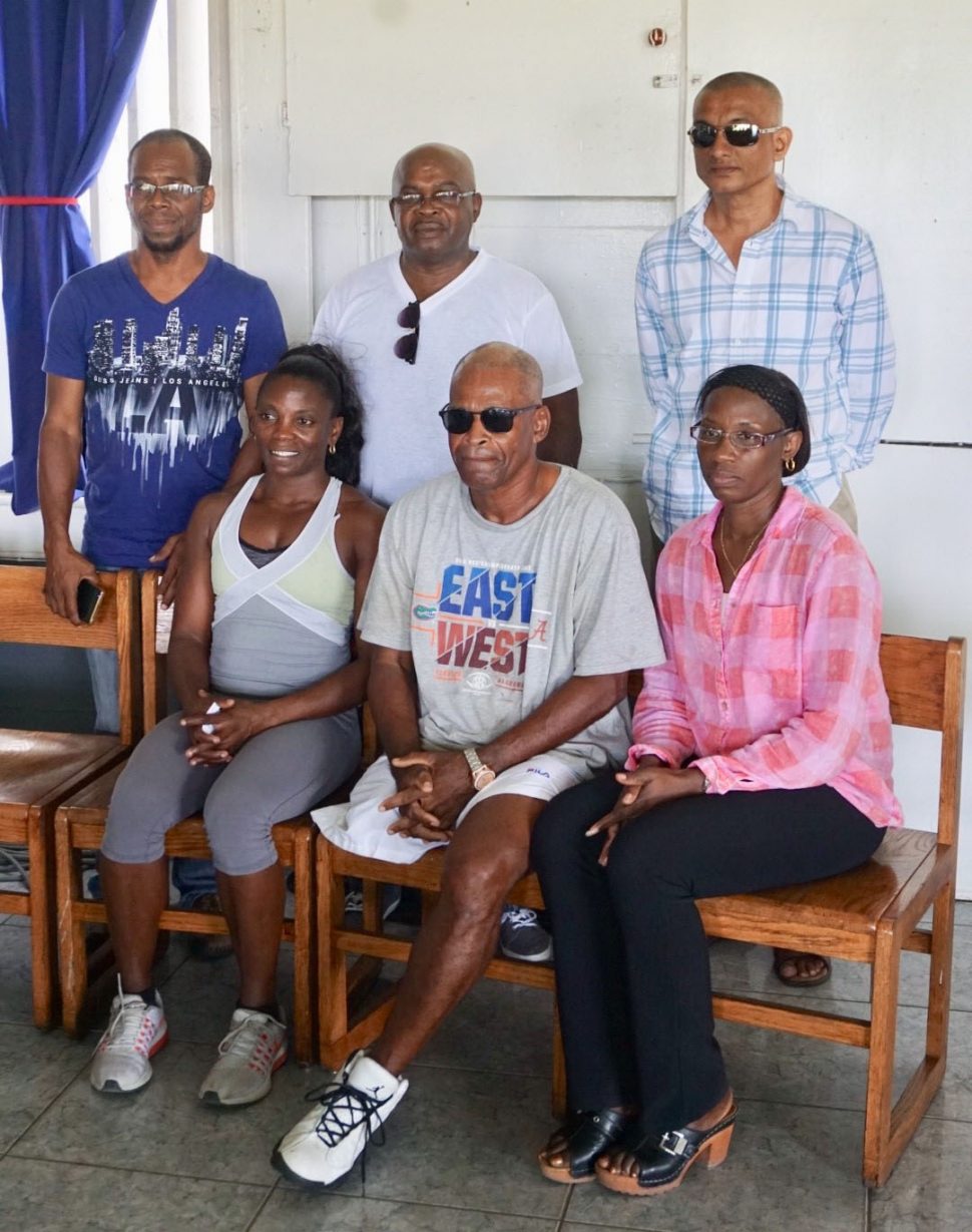 Alisha Fortune (seated left) and William France (seated centre) along with Leslie Black (standing centre) were  recognized by the Guyana Committee of Service yesterday at the GCC pavilion. They are flanked by executive member of the GCS, Lorrie Ann Adams (also seated), Joseph Ramkumar (standing right) and Linden ‘Jumbie’ Jones.
