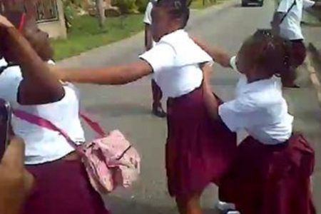 A camera phone recorded of a fight involving school children in east Trinidad.