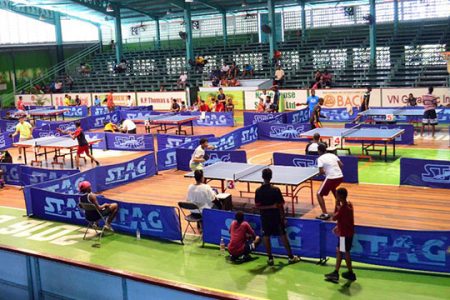 Some of the participants in action during last weekend’s National schools table tennis championships held at the Cliff Anderson Sports Hall. (Orlando Charles photo)