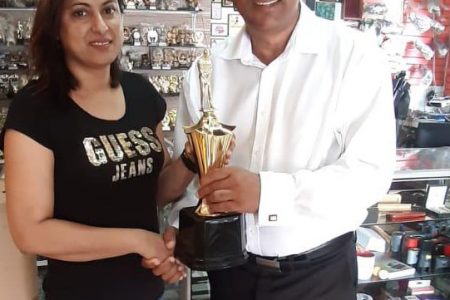 Trophy Stall’s Devi Sunich hands over the sponsorship to LGC President Aleem Hussain for the 2019 tournament