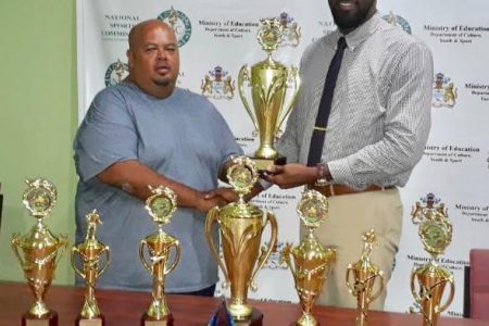 Director of Sports, Christopher Jones handed over trophies and a plaque Thursday to Troy Yhip (Events Coordinator) of the Guyana Rugby Football Union. 
