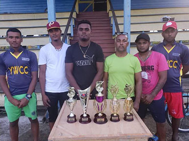 Members of the club pose with some of the trophies up for grabs 