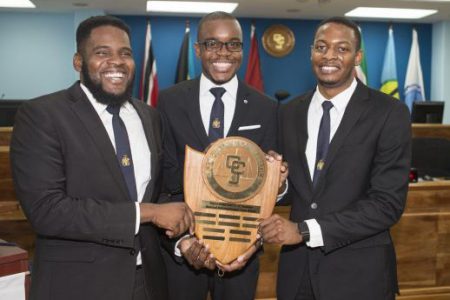 Winners of the 11th Annual CCJ International Law Moot Competition, The Hugh Wooding Law School, holding the CCJ Challenge Shield. In the photo are  Arthur Thomas,  Michael Munroe and  Roger Hector. (Dominica News Online photo)
