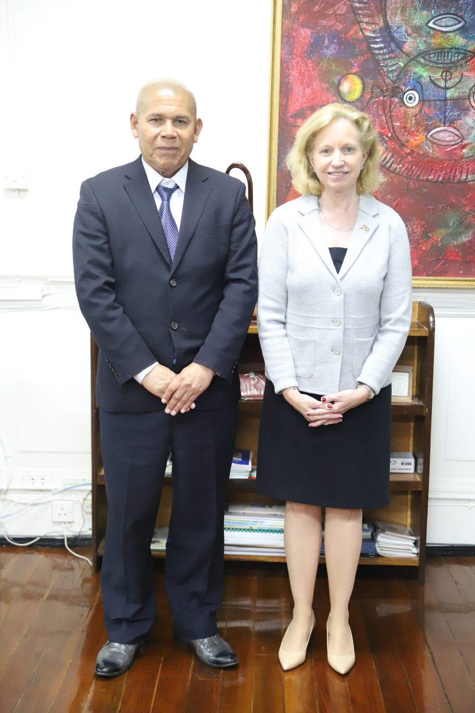  Minister of Social Cohesion Dr. George Norton with the newly-appointed United States Ambassador to Guyana Sarah-Ann Lynch on Friday after a courtesy call by the new ambassador. Following their meeting, Norton stated that they spoke about the development of the arts in Guyana and the possibility of collaborating to have workshops hosted by artists from the United States with an emphasis on the marketing of art. Norton added that the ambassador express-ed her desire to work with the ministry and he noted that they may be looking to create policies to help artists to be better able to profit from their work. (Photo by Terrence Thompson)

