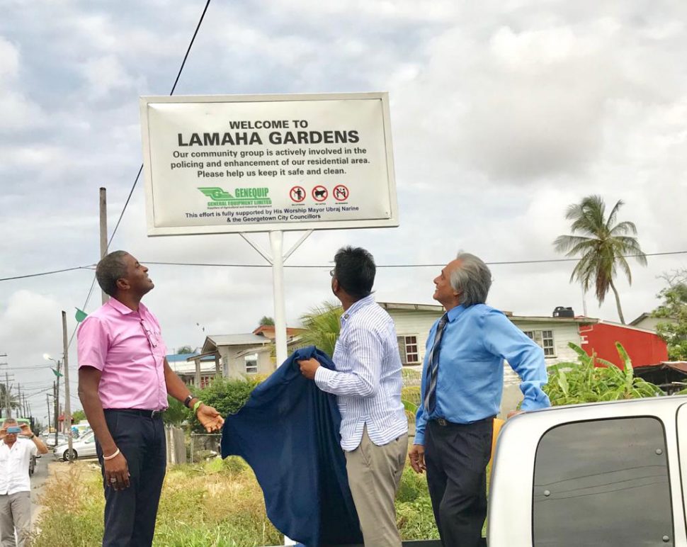  Residents of the Lamaha Gardens Community Co-operative Society, yesterday unveiled a welcome sign at the community’s entrance, located at the corner of Duncan Street and Bel Air Avenue. At the ceremony, the sign, which was donated by General Equipment and Supplies, was unveiled by Mayor Ubraj Narine (centre), Deputy Mayor Alfred Mentore (left) and head of the community group, Ronald Alli (right). The erection of the sign, the community said in a statement, signals their commitment to work with the Mayor and City Council. Alli yesterday stated that the sign’s placement illustrates a step in “addressing negative influences which impact residential communities, including our community, Lamaha Gardens.”