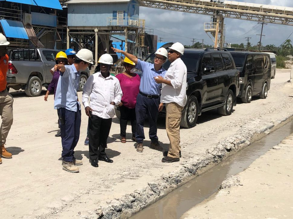 Minister of Natural Resources Raphael Trotman and South Africa’s Deputy Minister of Mineral Resources Godfrey Oliphant being shown a part of BOSAI’s operations yesterday morning. 