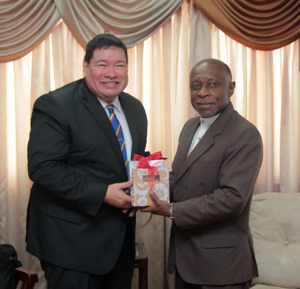 Outgoing Mexican Ambassador Ivan Roberto Sierra Medel (at left) and Vice President and Minister of Foreign Affairs Carl Greenidge, exchange gifts at the Ministry of Foreign Affairs in Georgetown. (Ministry of Foreign Affairs photo) 
