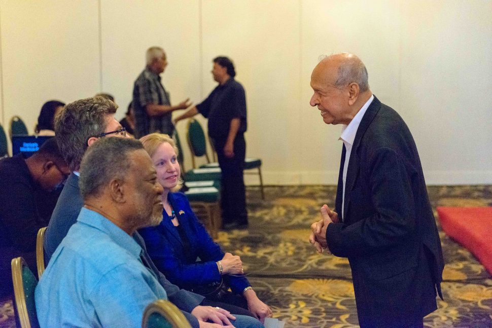 Yesu Persaud (at right) speaking with British High Commissioner to Guyana Gregory Quinn and other attendees on Wednesday at the screening event held at the Pegasus Hotel for “The Man from El Dorado,” a new documentary film on his life.