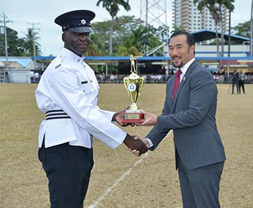 National Security Minister Stuart Young presents the Best Shot Recruit to PC Edwards during the TTPS Passing Out Parade ceremony 2019 at the Police Academy in St James yesterday.