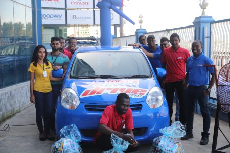 Employees of Tony’s Auto Spares, with the grand prize and three hampers. (Terrence Thompson photo)