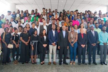 President David Granger (centre) with organisers and participants of the “Re-gional Youth Caucus”, held on Friday at the Arthur Chung Conference Centre. 