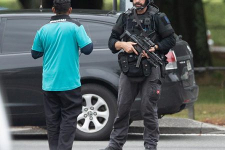 AOS (Armed Offenders Squad) push back members of the public following a shooting at the Al Noor mosque in Christchurch, New Zealand, yesterday. REUTERS/SNPA/Martin Hunter