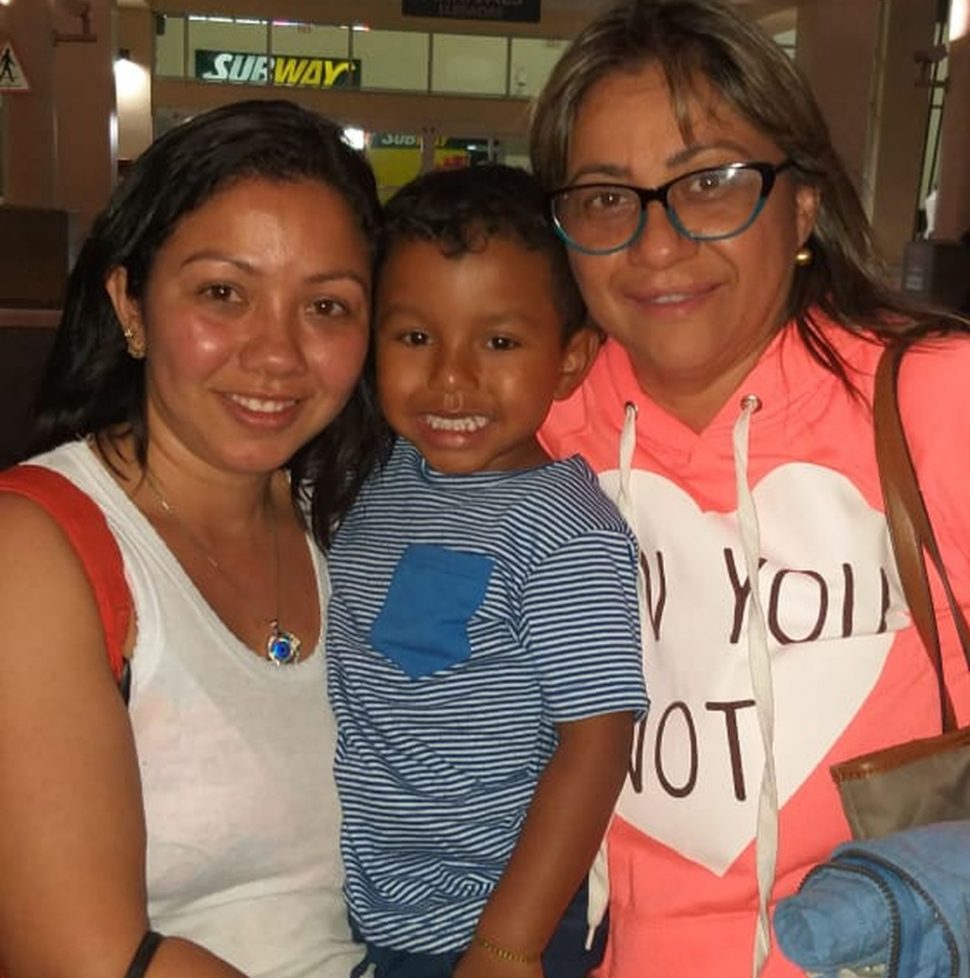 Three-year-old Jofiel (Center) reunited with his mother, Vanessa (left) after being refused entry into the country with his aunt, Juana (Right)