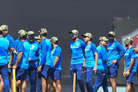 The Indian players with camouflage caps