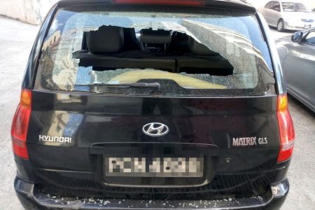 The tenant’s vandalised vehicle outside Clifton Towers in Port-of-Spain yesterday.